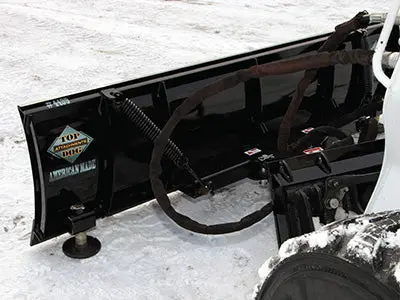 Skid Steer-Mounted Snow Cutting Blade
